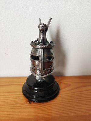 Collectible silver medieval knight helmet with winged dragon on display base like new