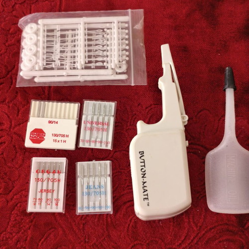 Sewing Machine Accessories Set like new with Needles, Button-Mate Tool & Oil