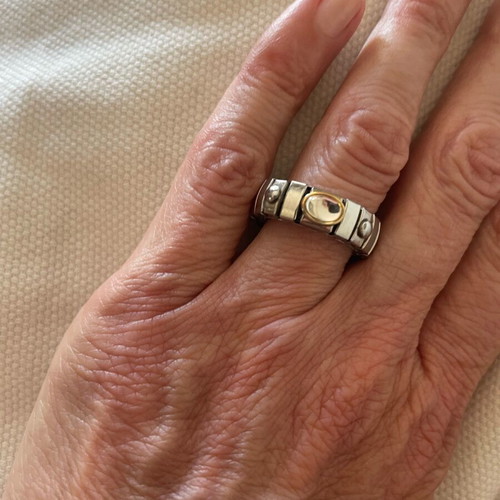 Stainless steel ring with gold detail and clear stone like new