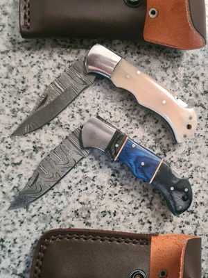 Damask folding knife handmade with leather sheath and camel bone handle