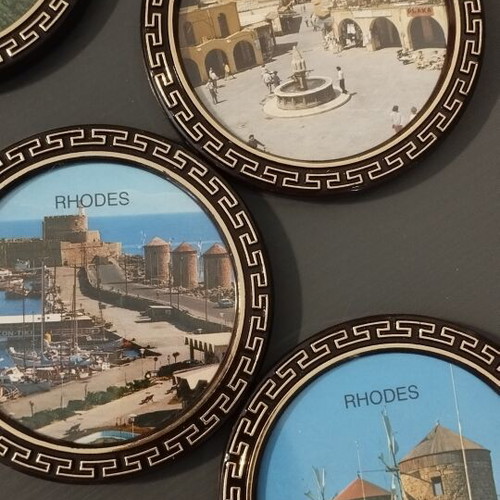 Vintage coaster set of 5 with original black holder from Rhodes