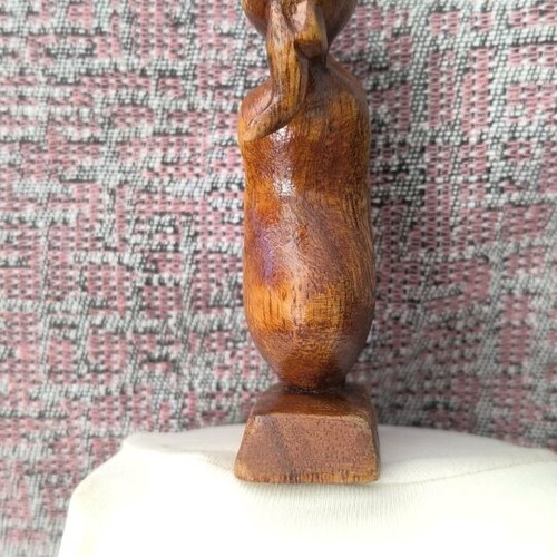 Wooden sculpture embrace like new, natural material decoration