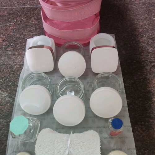 Cosmetic storage set like new with empty jars and pink pouch