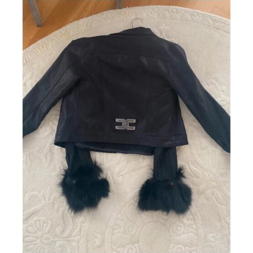 Short black reversible jacket with faux fur cuffs