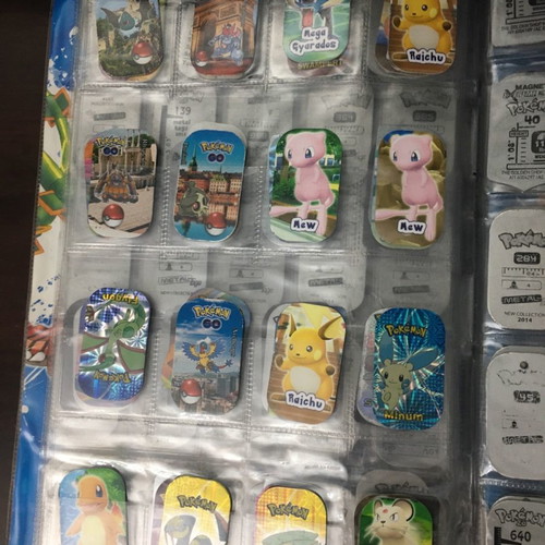 Pokémon album with metal tags used
