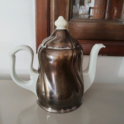 Vintage teapot used, ceramic porcelain with metal silver-plated holder