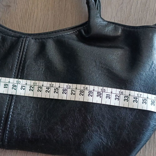 Handbag new with strap, black synthetic leather