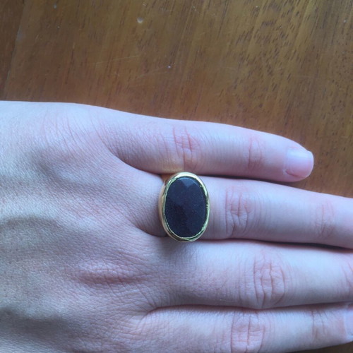 Faux ring like new, gold with black stone and adjustable size