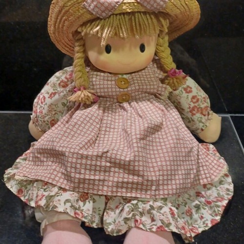 Doll like new with cotton clothes and straw hat