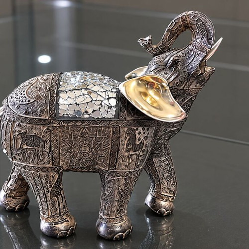 Decorative elephant vintage with embossed Asian-inspired carvings used
