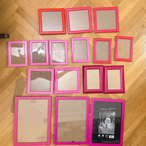 Set of 16 used wall frames in pink and red shades