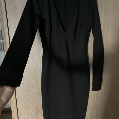 Celestino black fitted dress with deep V neckline like new
