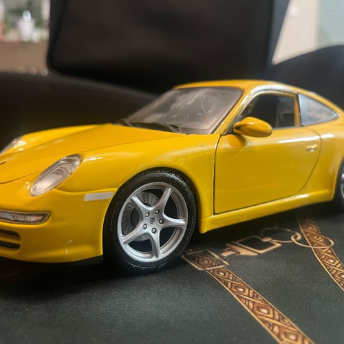 Porsche Carrera yellow 1:18 like new with hazy front windshield