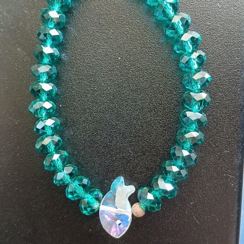 Bracelet with crystal beads used, emerald/petrol color with fish motif