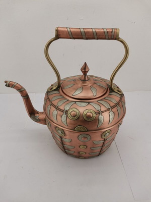Copper teapot used with embossed 1930s decorations