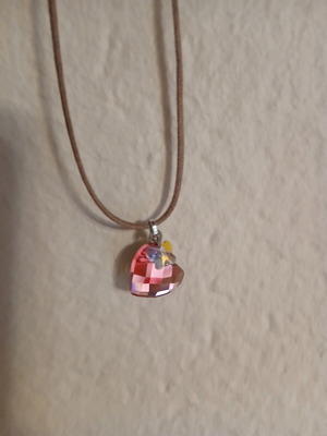 Swarovski pendant pink heart with small butterfly on brown leather strap like new