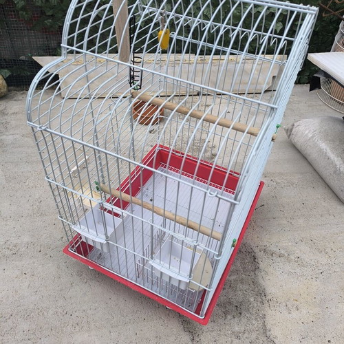 Metal birdcage like new with perches and feeders