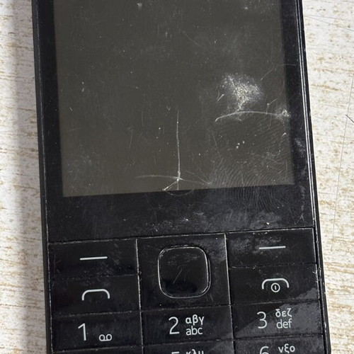 Nokia 225 used phone with cracked screen and missing back cover