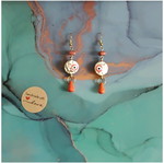 Handmade earrings with orange details and Greek eye