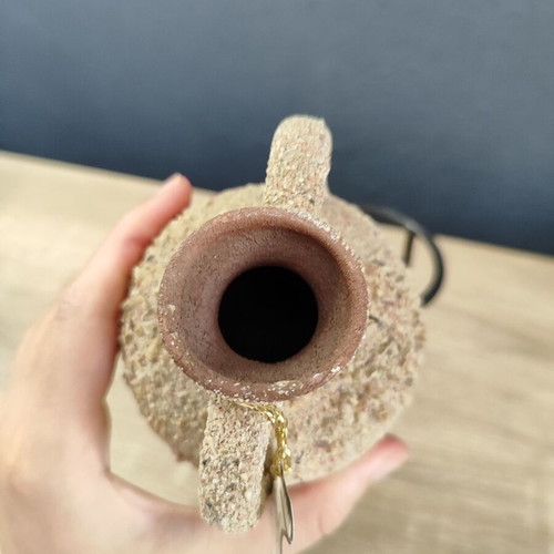 Handmade ceramic amphora decorative vase on metal base used
