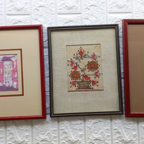 Artistic framed folk art pieces like new