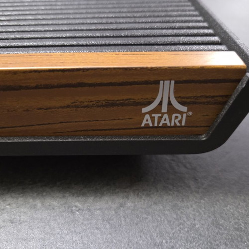 Atari 2600 VCS Woody console used with two joysticks and Demon Attack game