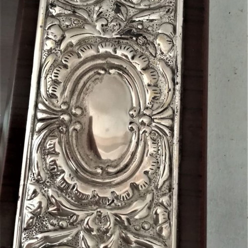 Wooden serving tray lacquered with silver embossed handles