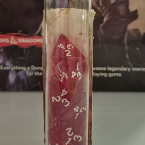 DnD healing potion bottle with 10 red tetrahedral dice