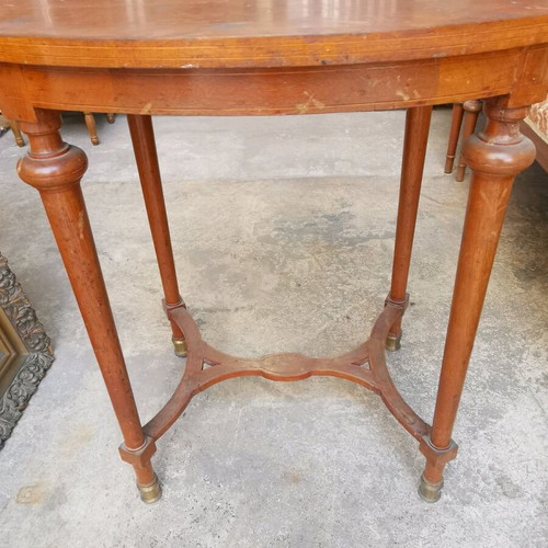 Vintage oval wooden coffee table used with brass feet