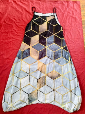 One-piece jumpsuit used, medium size, elastic hem, wide fit