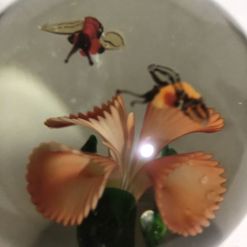 Handblown glass dome paperweight with stylized bees