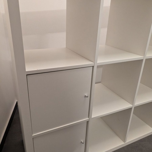 IKEA Kallax white shelving unit with 4 inserts
