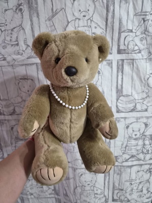 Teddy bear with pearls like new