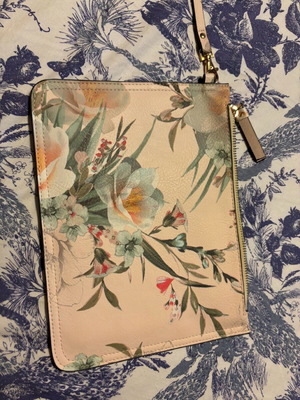 Multicolored handheld bag in pale shades