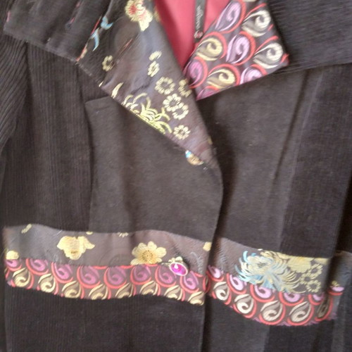 Black corduroy/velvet coat like new, size L/XL with colorful designs