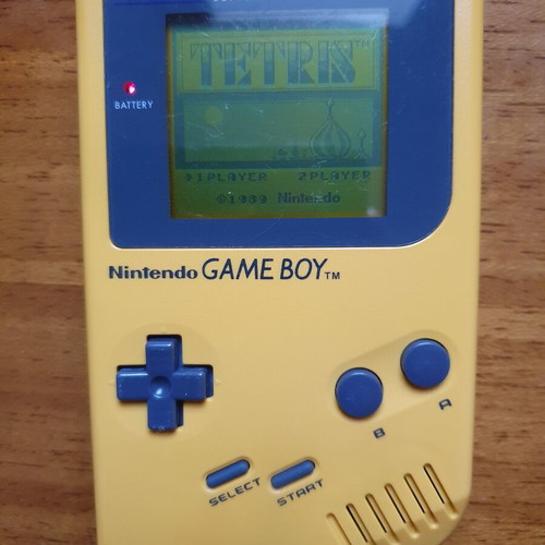 Game Boy DMG Play It Loud Edition used with Tetris cartridge