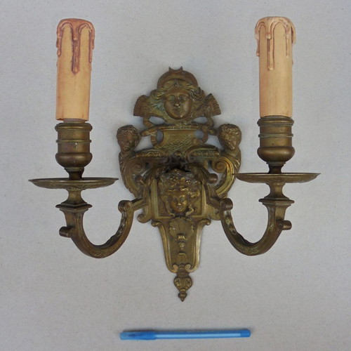 Pair of bronze antique two-light wall sconces, late 19th century