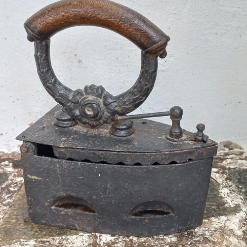 Karavaki Charcoal Iron used with ornate handle design