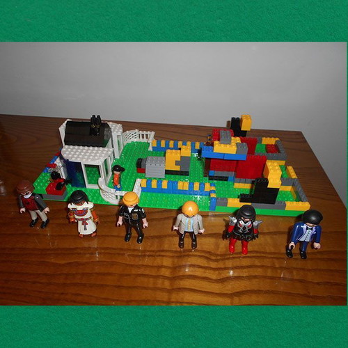 Building toy with Lego bricks and 6 Play Mobil figures used