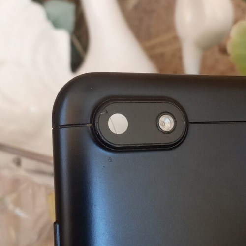 Redmi 6A black back cover with cracked camera lens