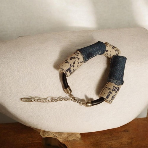 Handmade leather cord bracelet with blue and white beads, silver clasp