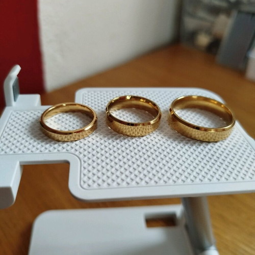 Set of new stainless steel rings, two women's and one men's