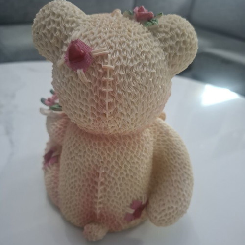 Collectible teddy bear with doll and roses, like new