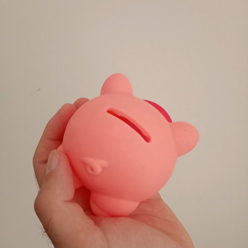 Piggy bank used, made of hard plastic