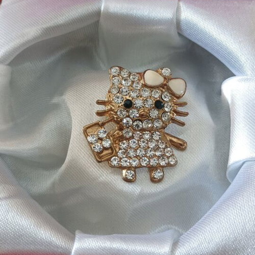 Hello Kitty pin new, gold color in box