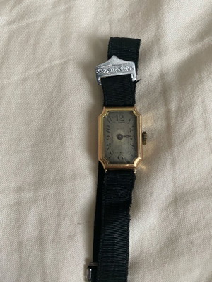 Vintage women's wristwatch used with 14K gold and black strap