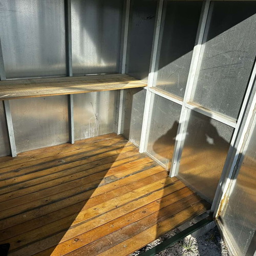 Heavy-duty steel storage shed used for storage space