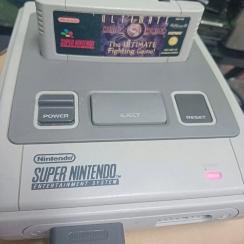 Super Nintendo 1990 console with 2 controllers and 3 games