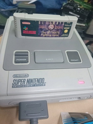 Super Nintendo 1990 console with 2 controllers and 3 games