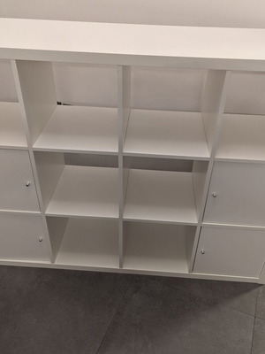 IKEA Kallax white shelving unit with 4 inserts